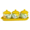 A set of three ceramic seasoning jars with lemon patterns on a yellow tray Item Picture